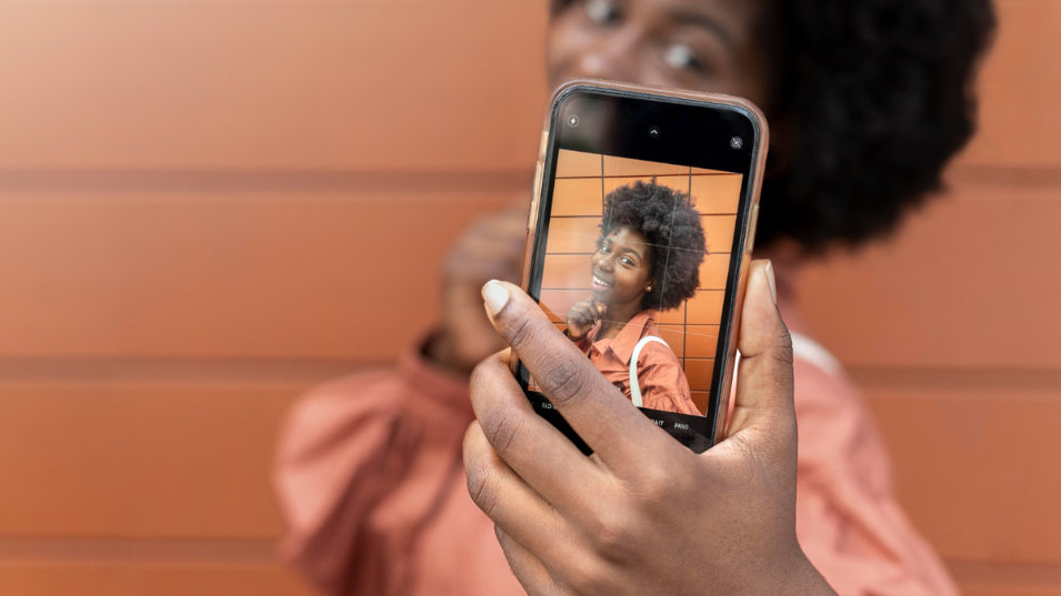 What Businesses Should Know About Instagram. Woman Taking a Selfie