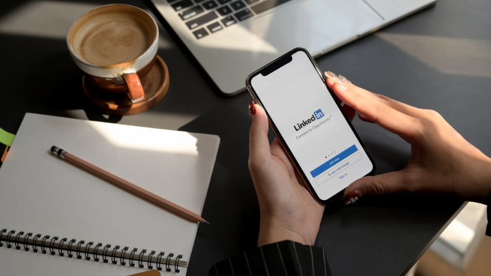 What Businesses Should Know About LinkedIn. Hands Doing Work on LinkedIn